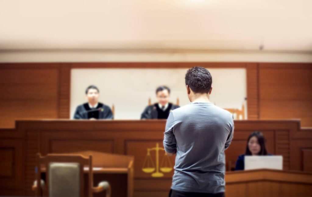 The lawyer speaks to the judge