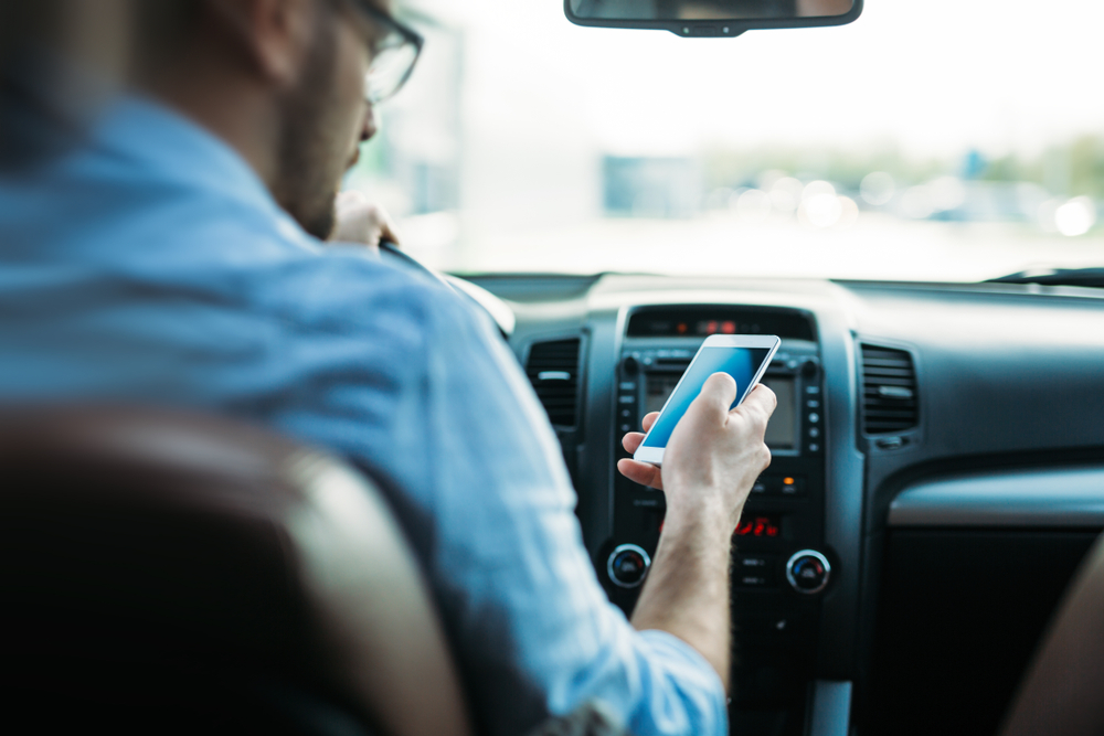  Man Using Phone